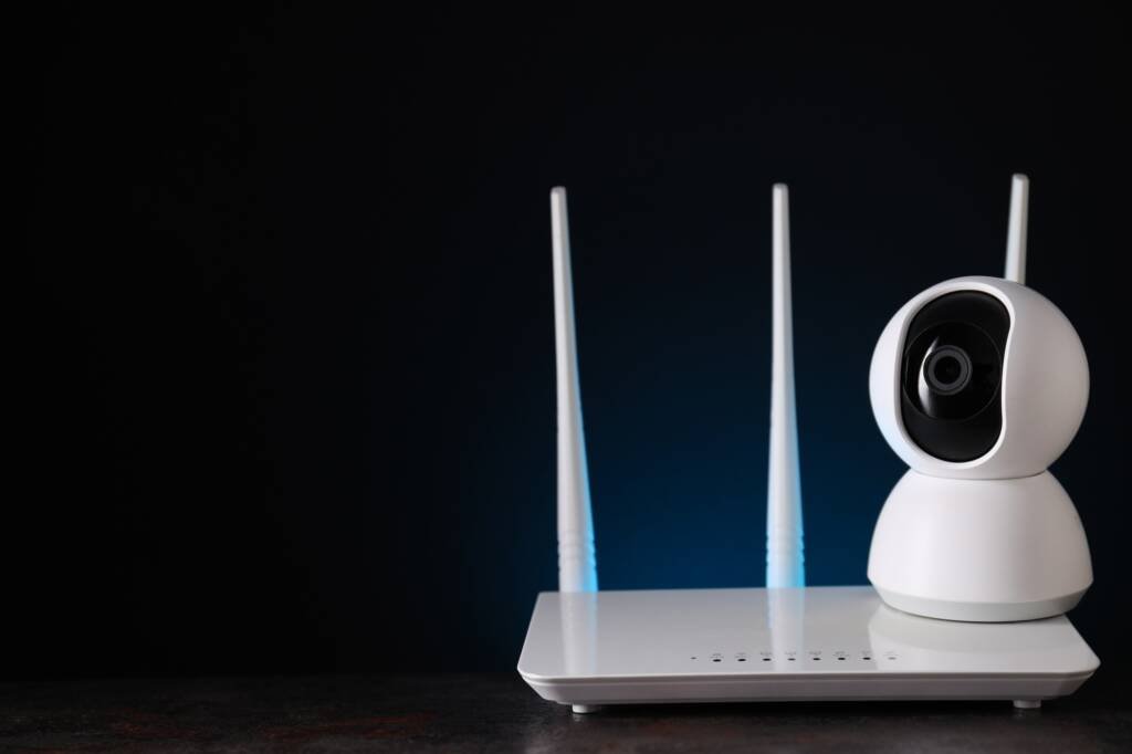 White video surveillance camera with Wi-Fi router